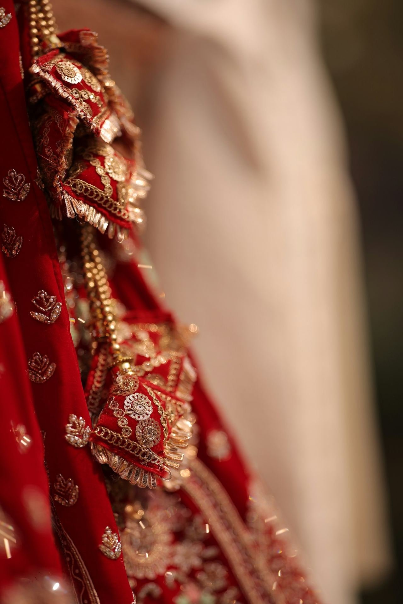 Red and gold bridal lehenga detailing stitched at Tints and Shades by Rachna